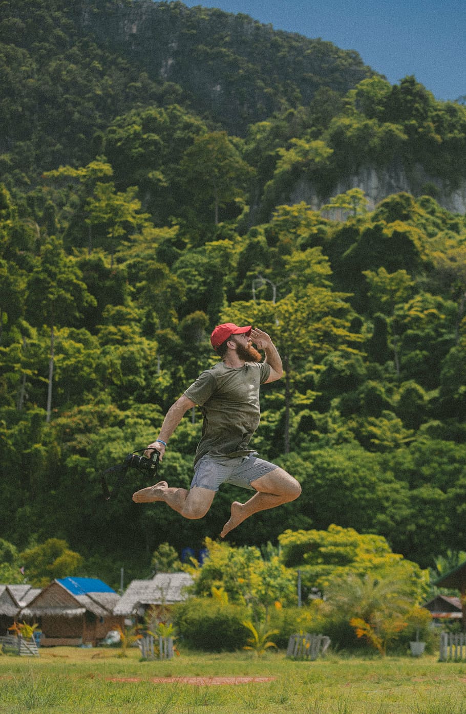 man, jumping, high, holding, camera, green, grass, trees, plant, house