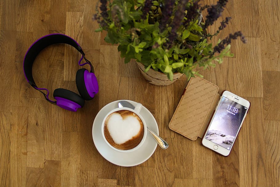 coffee, cup, headphones, hand, smartphone, plant, wood, wood floor, communication, texture