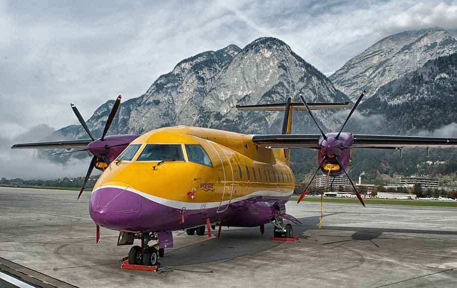 yellow, purple, plane, airport, innsbruck, austria, mountains, sky, clouds, airplane