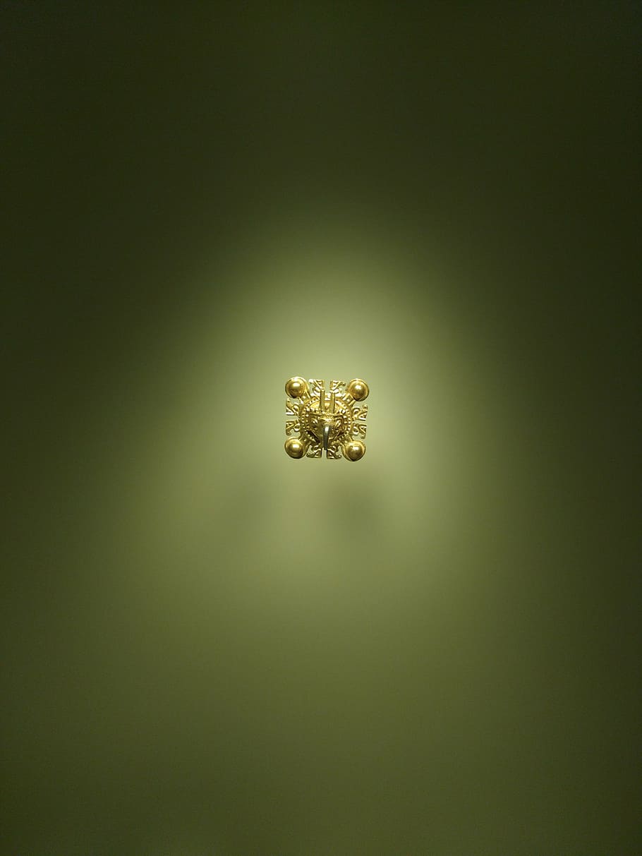 gold, piece of gold, gold museum, bogotá, studio shot, copy space, indoors, colored background, single object, spotlight