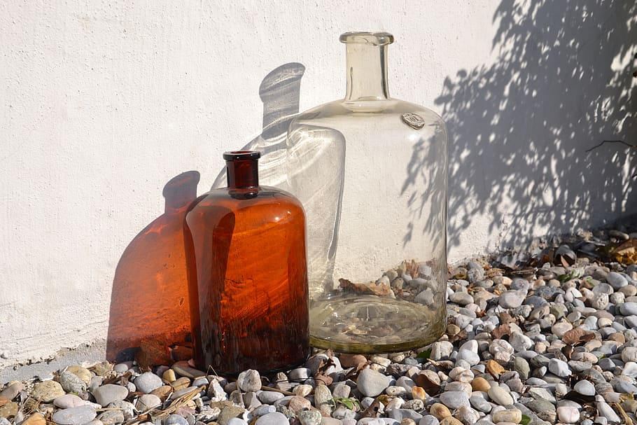 bottles, old, blown, transparent, brown, glass, light, shadow, stones, rose hip