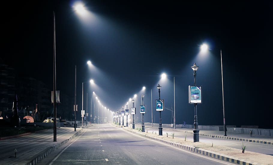 roadside parking lot, streetlamps, nighttime, streetlight, night, city, street, light, urban, lamp