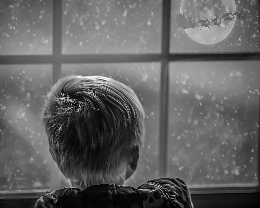 grayscale photo, boy, leaning, window, looking, moon, nighttime, magical, childhood, christmas