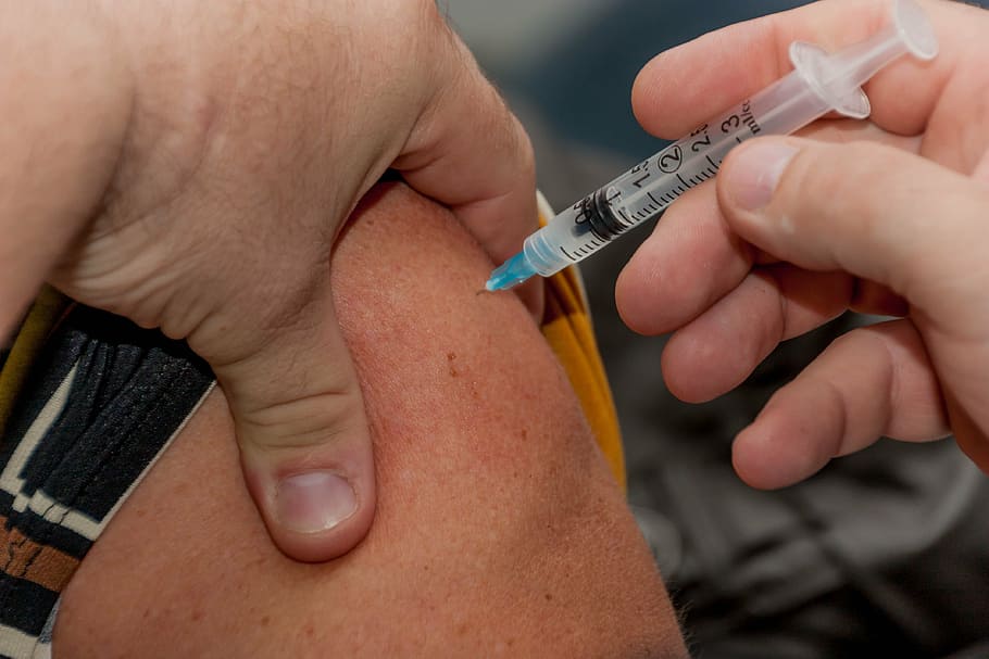 person, holding, syringe, injected, skin, flu shot, needle, ouch, medical, vaccination