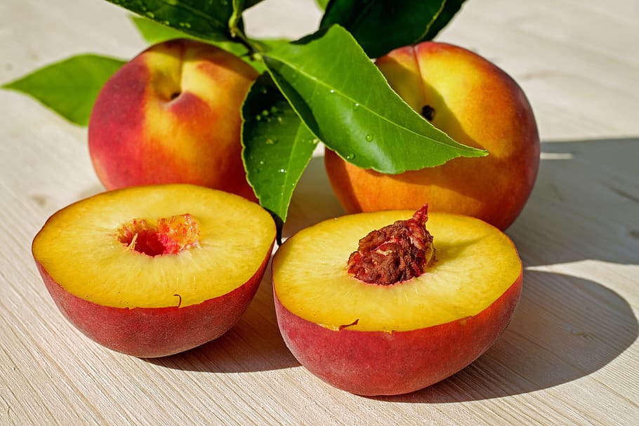 several sliced peach, peach, fruit, red, yellow, juicy, ripe, delicious, sweet, healthy
