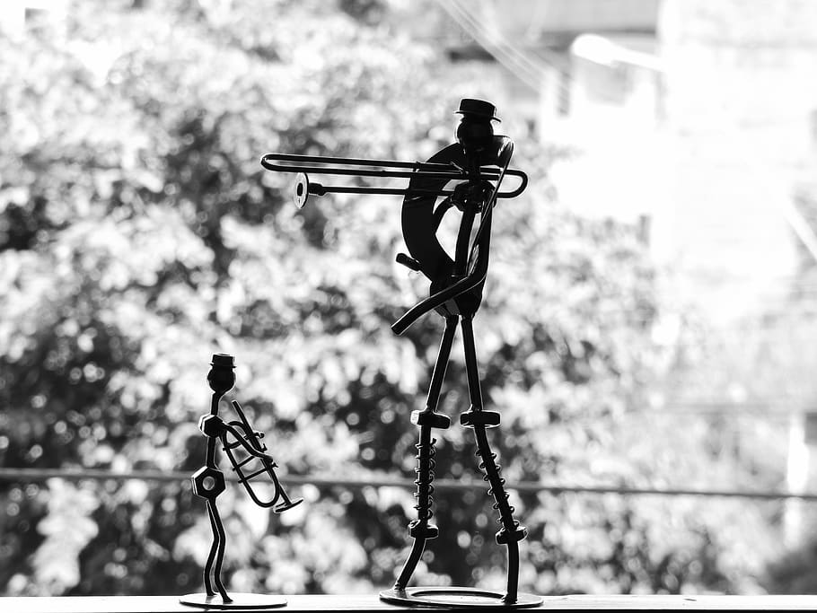 statuette, decorations, musicians, trombone, trumpet, music, focus on foreground, human representation, metal, day