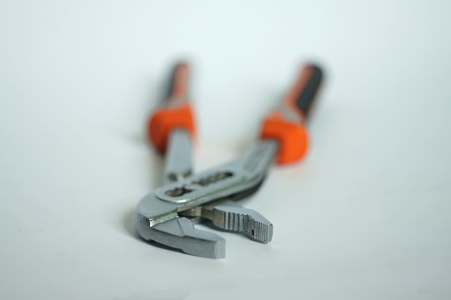 closeup, orange, black, hand tool, pincers, nippers, pliers, caliper, plumber, key