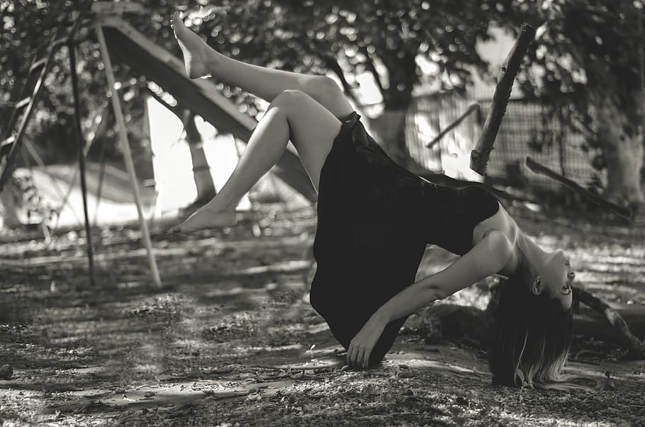 grayscale photo, woman, wearing, black, dress, slide, women, levitation, in the air, falling down