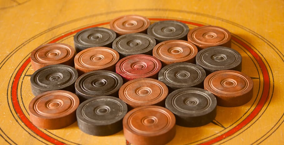 carrom, karrom, table game, game, pieces, coins, large group of objects, craft, indoors, close-up