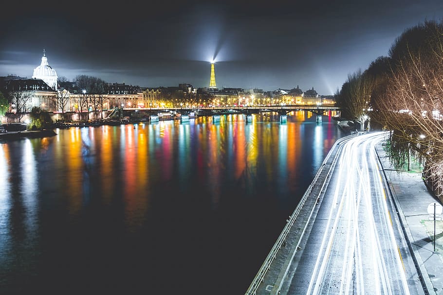 timelapse photo, city lights, paris, france, cityscape, river, water, road, reflection, night