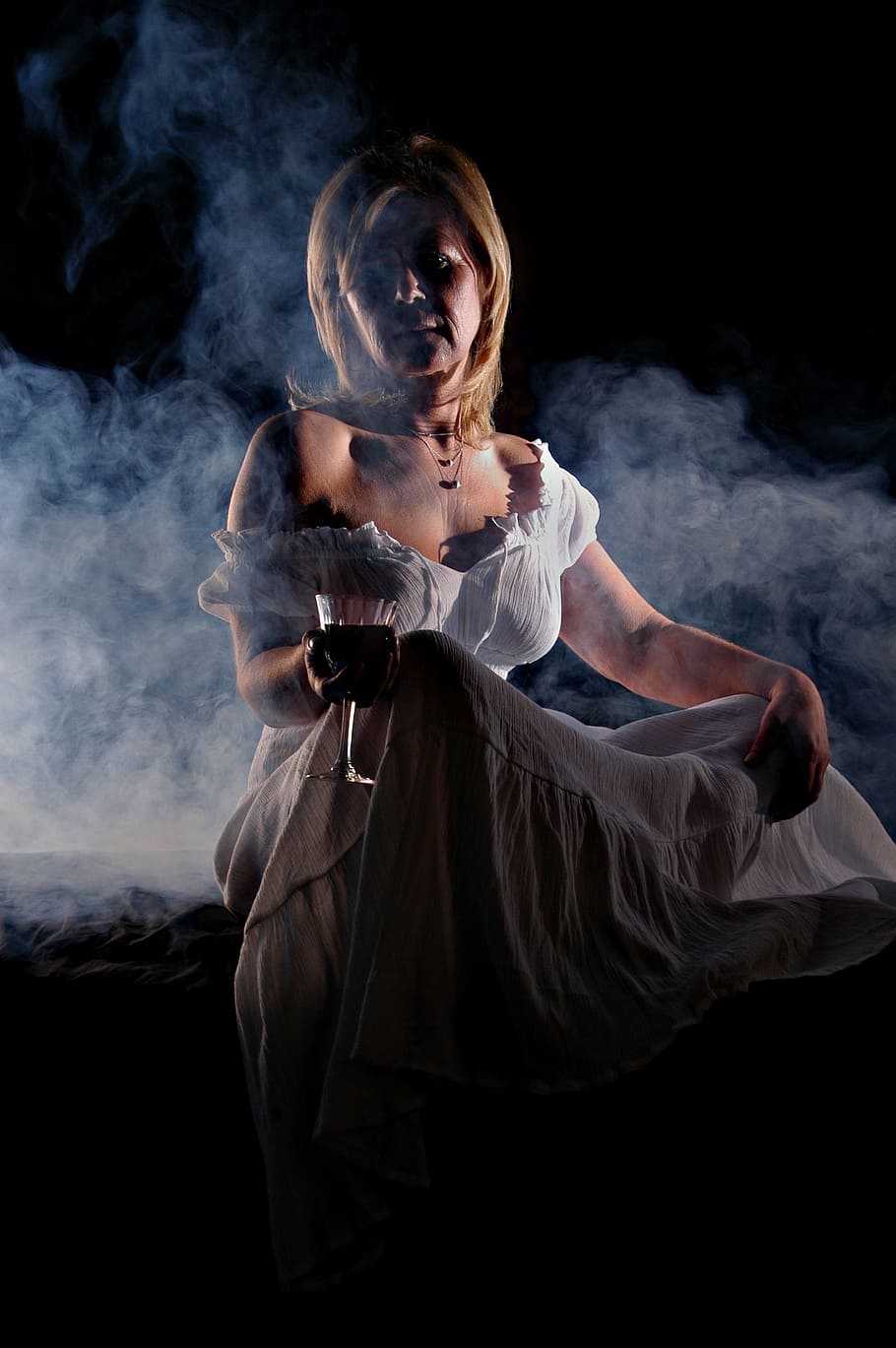 woman, holding, wine glass, mysterious, blonde, temptation, white dress, one person, smoke - physical structure, black background