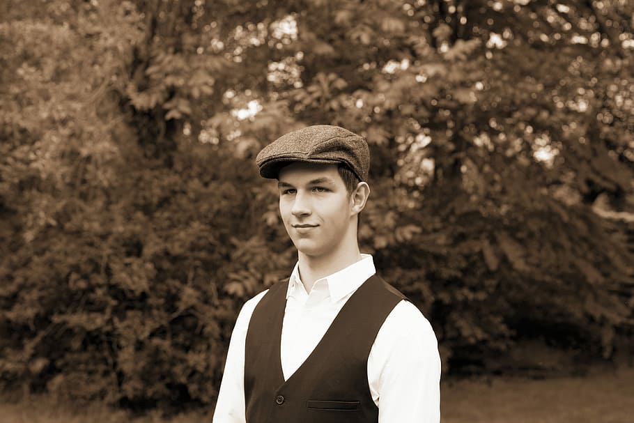 smiling, man, wearing, vest, standing, tree, young man, 1920s, sepia, cap