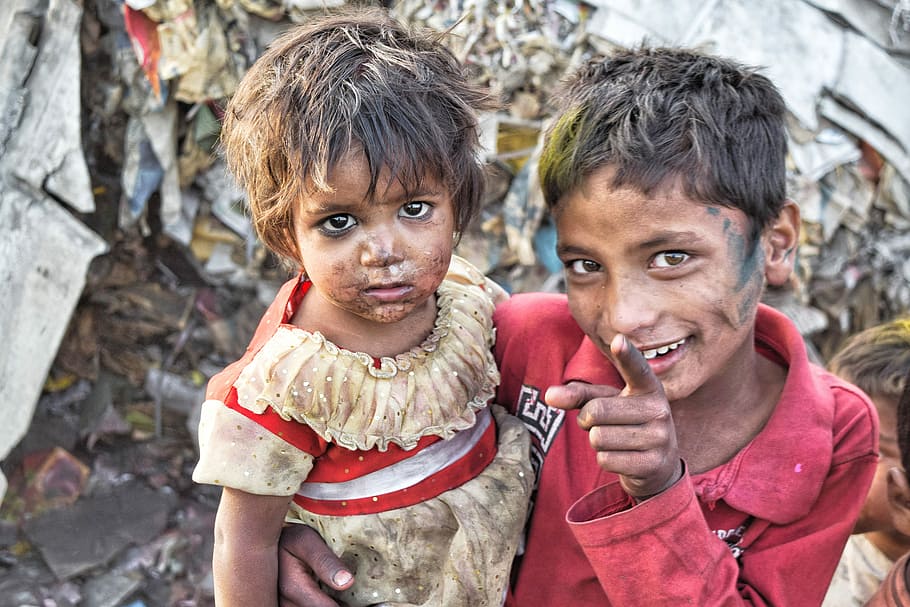 girl, wearing, beige, dress, boy, red, long-sleeved, polo shirt photograph, India, Slums
