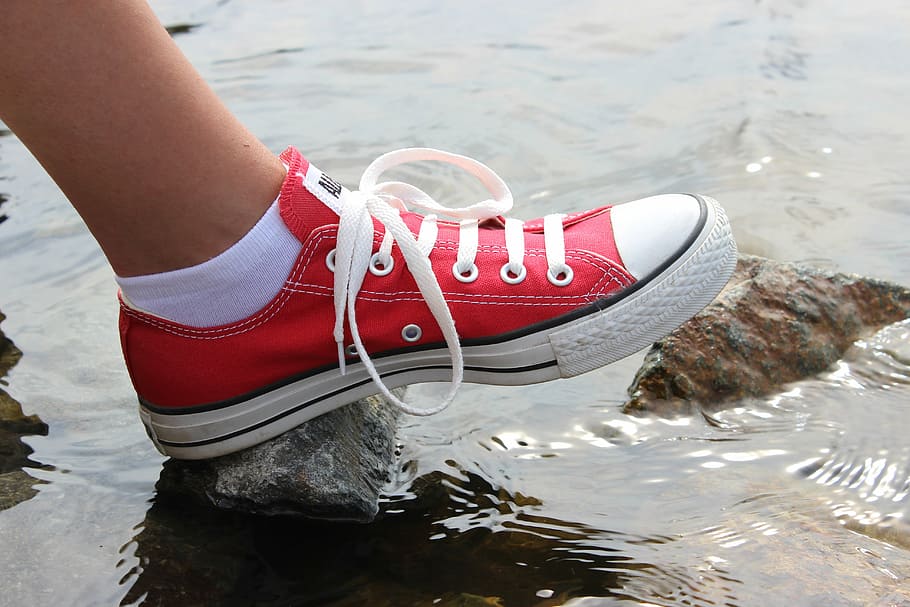 outdoors, converse shoes, sneakers, feet, red, water, one person, human body part, shoe, day