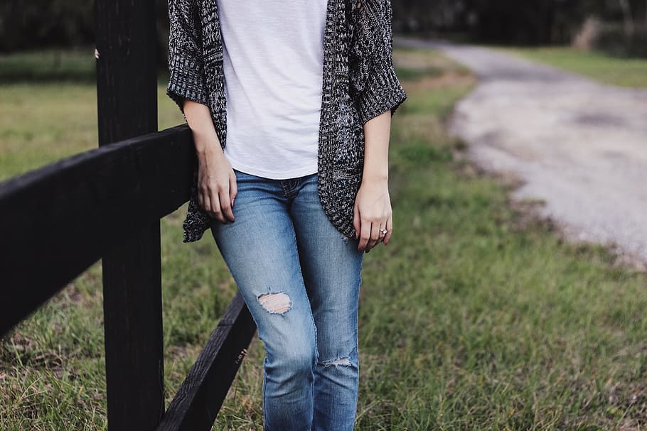 person, wearing, black, cardigan, distressed, blue, denim jeans, jeans, fashion, style