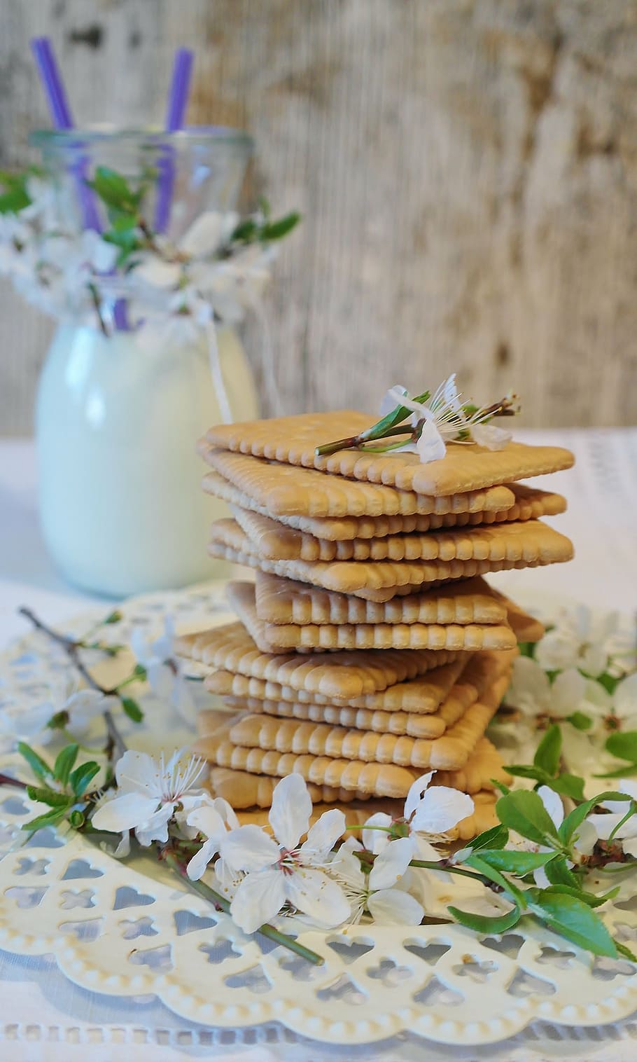 rectangular, biscuits, surrounded, white, 5-petal, 5- petal flowers, cookies, butter biscuits, glass, milk