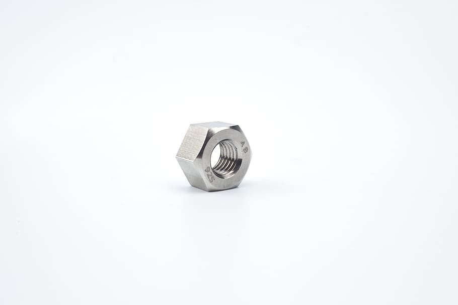 chrome-colored hex nut, white, background, screw, nut, metal screws, steel, metal, equipment, copy space