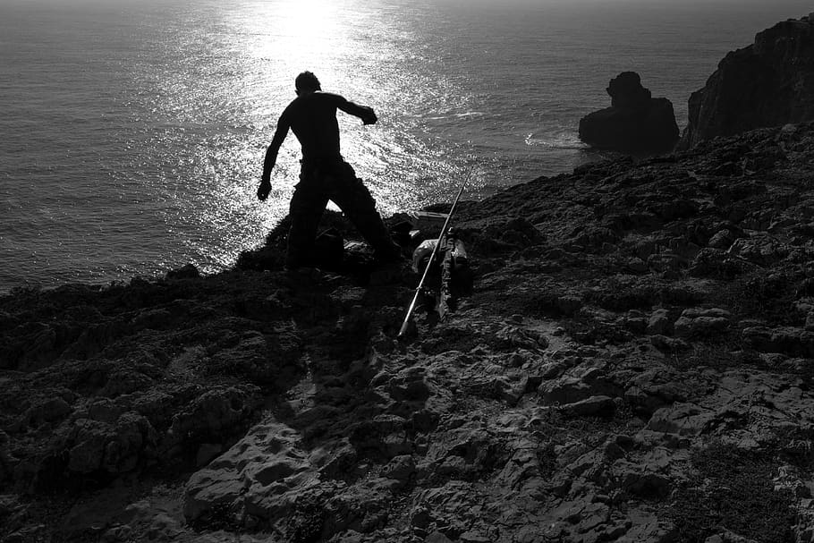 fisherman, fishing, beach, sand, water, shadow, silhouette, black and white, sea, rock