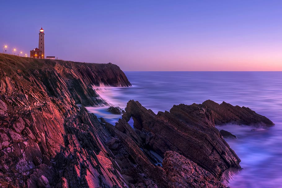 lighted lighthouse photo, beach, coast, colorful, colourful, dawn, dusk, evening, landscape, light
