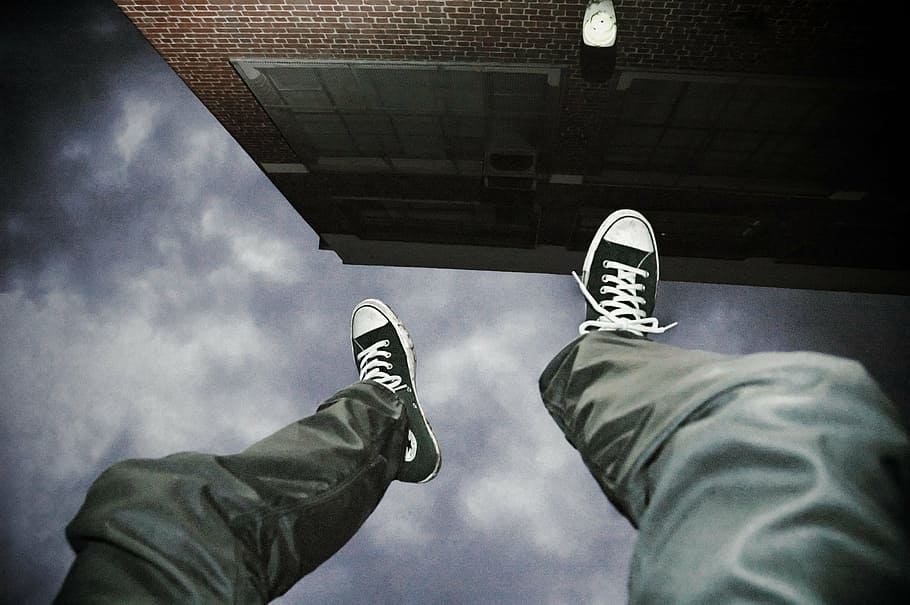 person, wearing, black-and-white, lace-up sneakers, falling, suicide, man, jump, upside down, danger