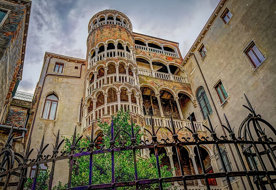 brown, concrete, building, black, fence, spiral staircase, corkscrew stairs, venice, italy, houses