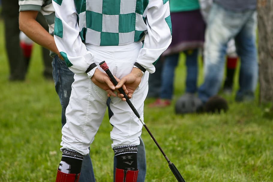 jockey, racing, sport, horse riding, hands, whip, midsection, focus on foreground, grass, real people