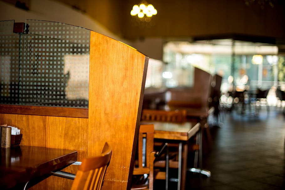 selective, focus photography, brown, wooden, table, wall, restaurant, chair, divider, modern