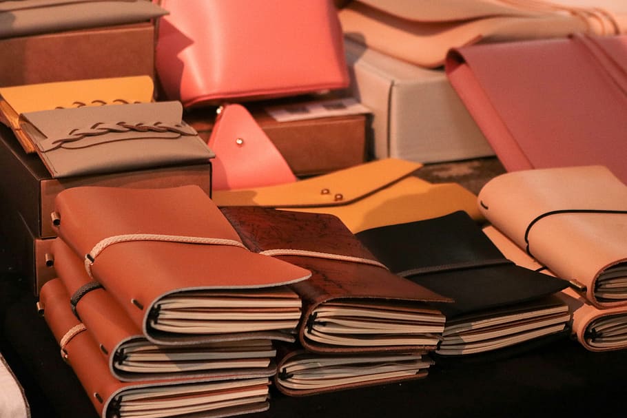 market, pda, book, book cover, manual, stack, indoors, retail, large group of objects, leather