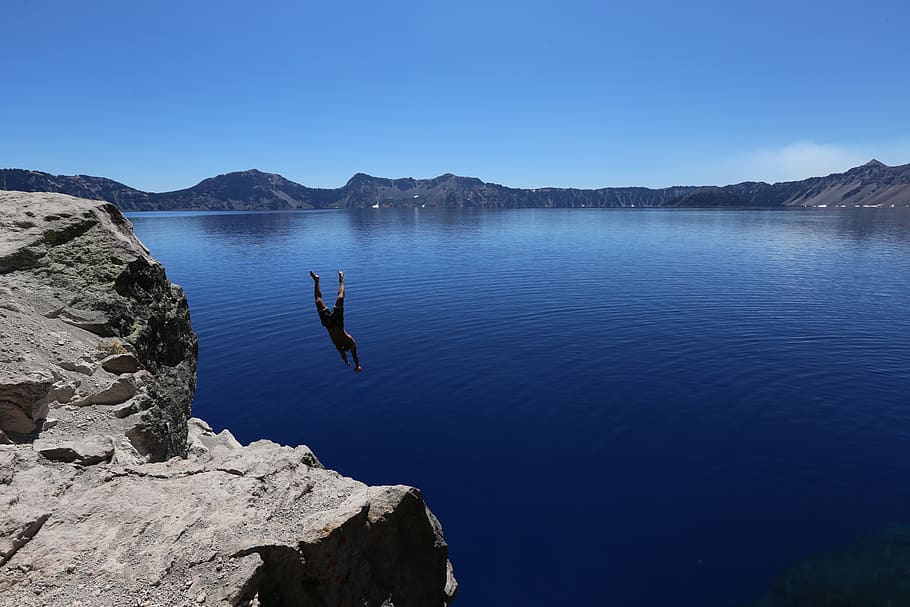 man, diving, lake, water, cold, cliff, blue sky, clear, still, calm