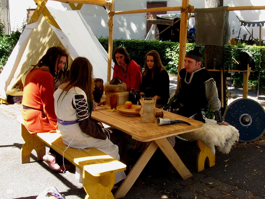 camp life, kenzingen medieval festival, historically, costumes, real people, table, sitting, food and drink, group of people, lifestyles