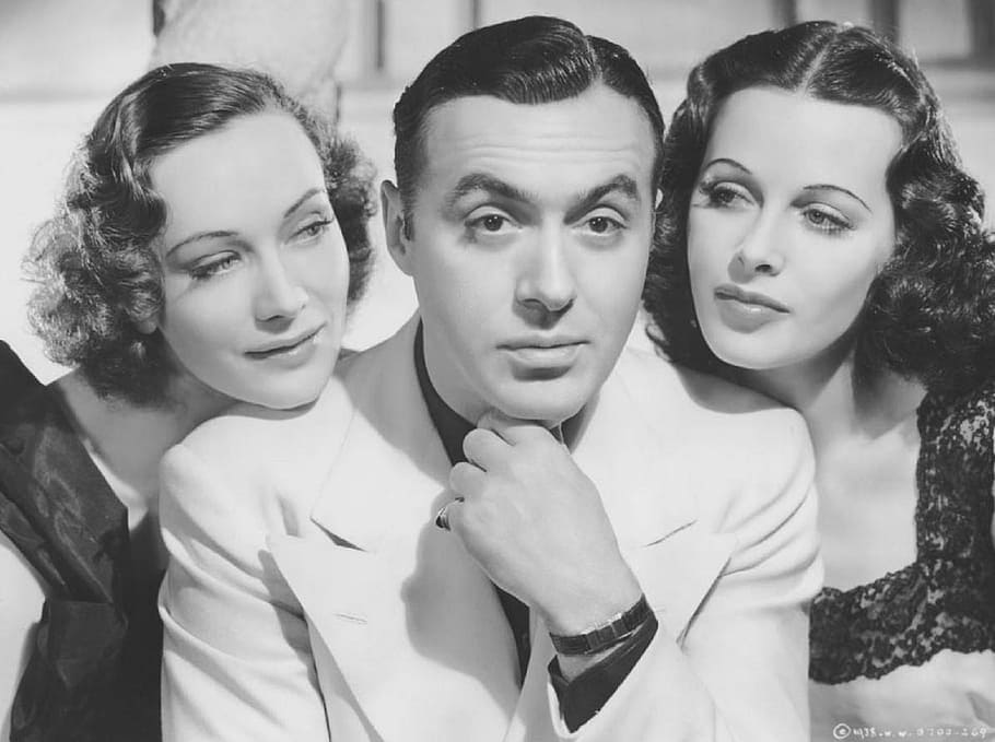 grayscale photo, man, suit jacket, two, women, sigrid gurie, charles boyer, hedy lamarr, actress, actor