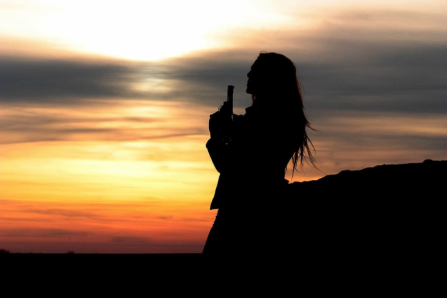 woman's silhouette, girl, pistol, impuscatura, gangster, mission, shadow, in the evening, sunset, silhouette