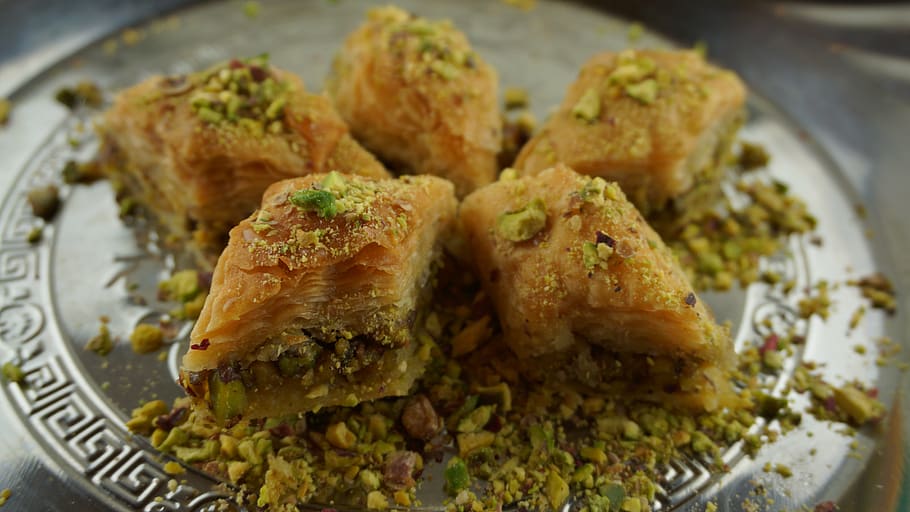 baklava with pistachios, oriental pastries, sweet pastries, food and drink, food, ready-to-eat, freshness, plate, close-up, indoors