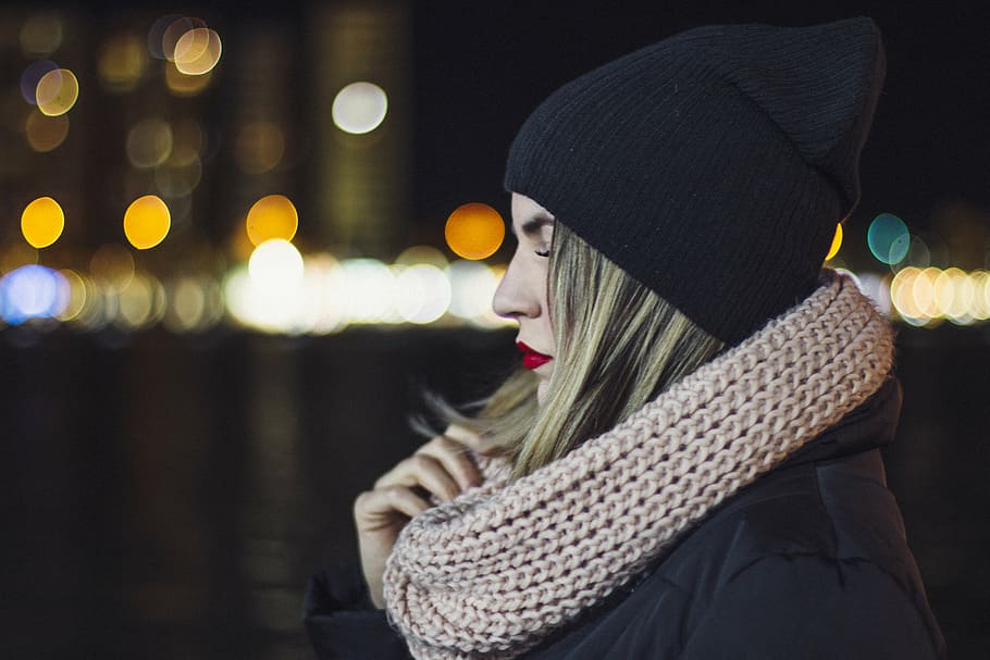 woman, wearing, black, knit, cap, holding, gray, lace scarf, dark, night