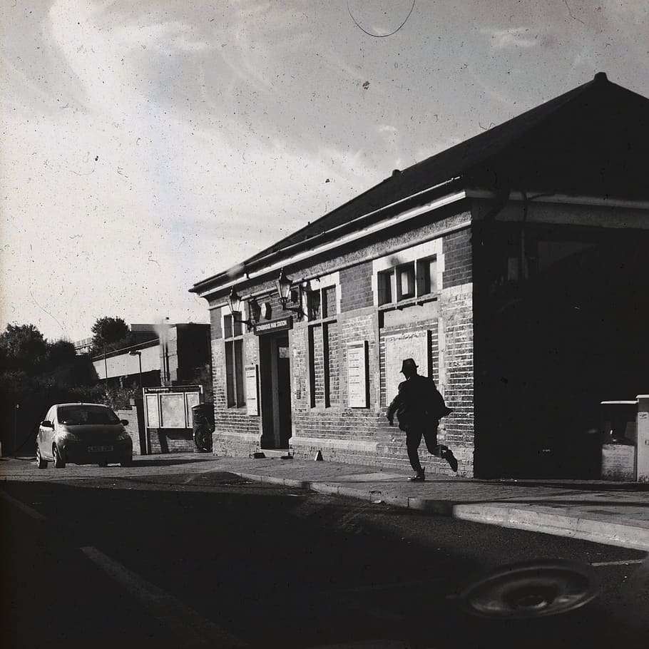 grayscale photo, man, running, building, detective, film, action, mystery, scene, work