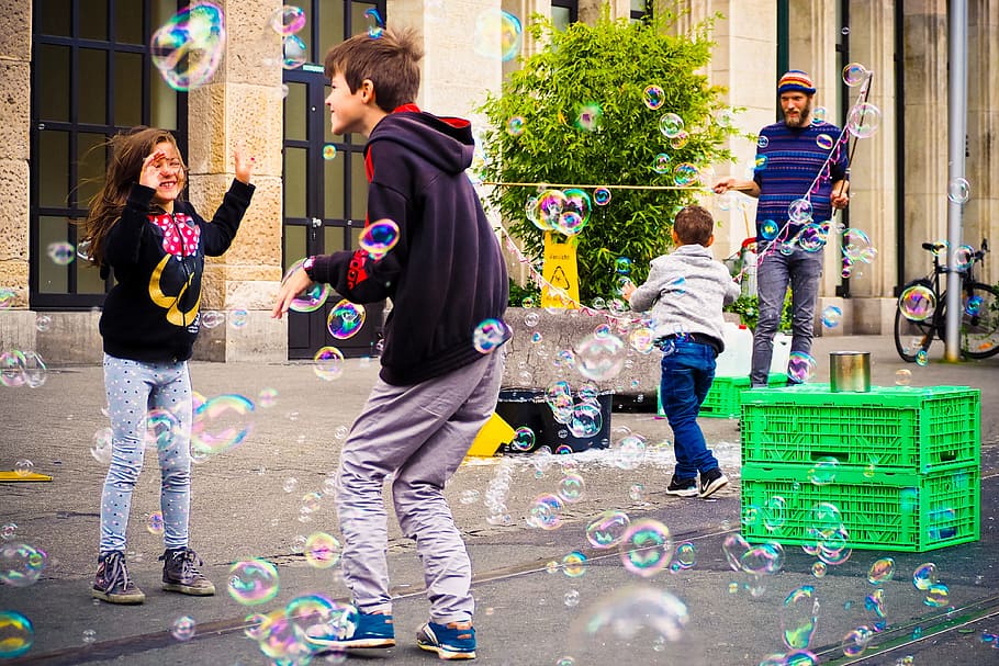children, playing, bubbles, daytime, road, play, colorful, girl, boy, moment