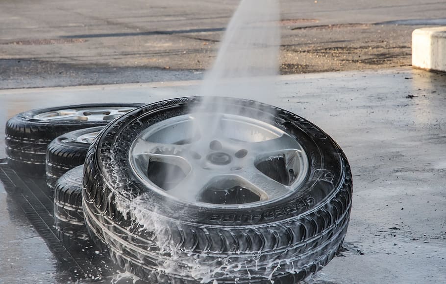 water spray, pointing, gray, 5-spoke, vehicle wheel, tire, set, concrete, floor, mature