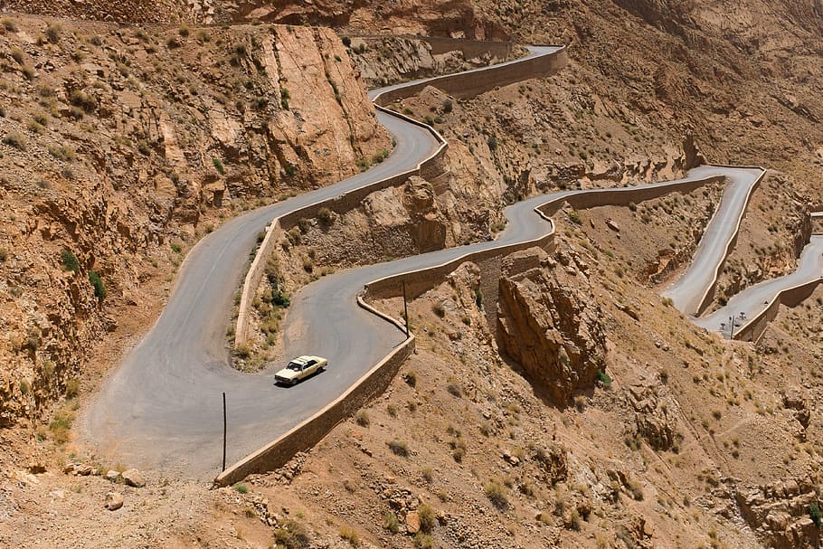 white, car, traveling, narrow, curve roads, daytime, serpentines, twisting, winding, road