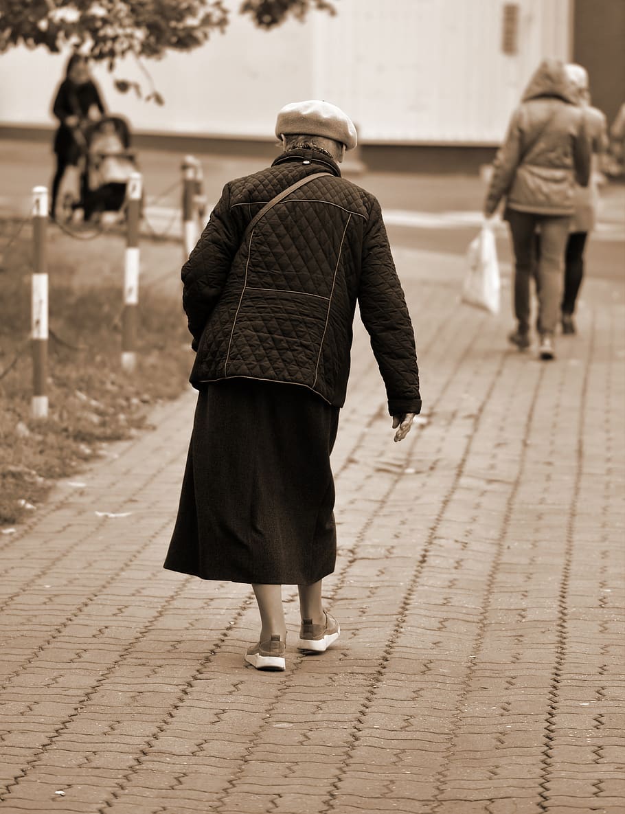 woman, person, old, going, bent over, the sidewalk, street, building, people, autumn