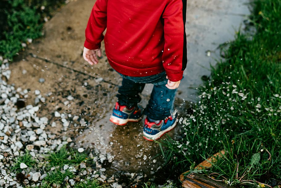 toddler, standing, sidewalk, green, grass, kid, red, jacket, jumping, water