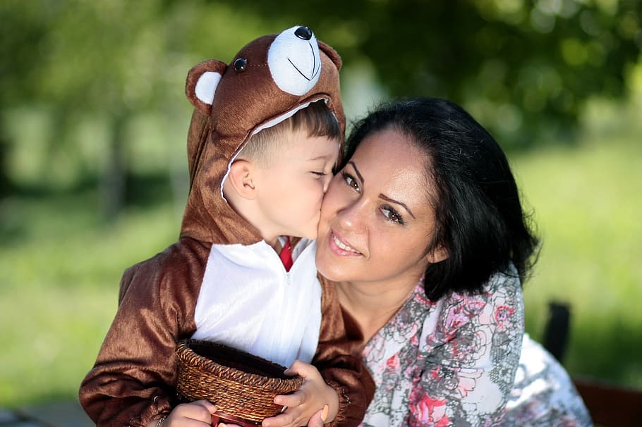 toddler, brown, bear, pramsuit, kissing, woman, cheek, mom, son, kiss