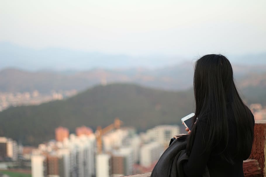 woman, standing, terrace, facing, high, rise buildings, guangdong pingyuan, before rain, mountains city, rear view