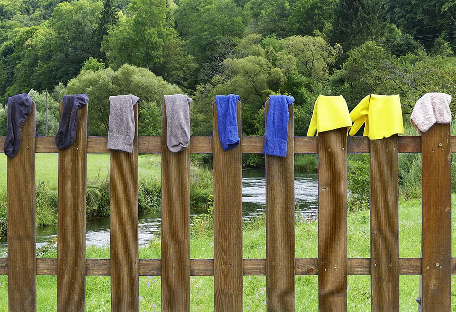 fence, laundry, dry, wood fence, paling, socks, rubber gloves, rag, cleaning rags, suspended