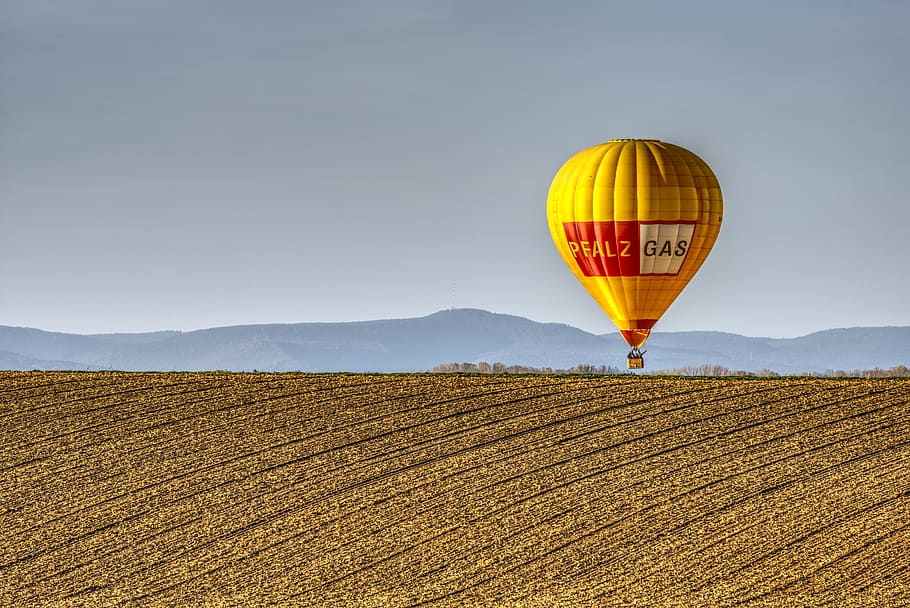 yellow, red, hot, air balloon, daytime, balloon, hot air balloon, field, landscape, blue sky