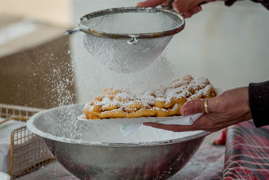 person, holding, brown, metal strainer, Funnel Cake, Grease, Hot Oil, hot grease, cooking, festival