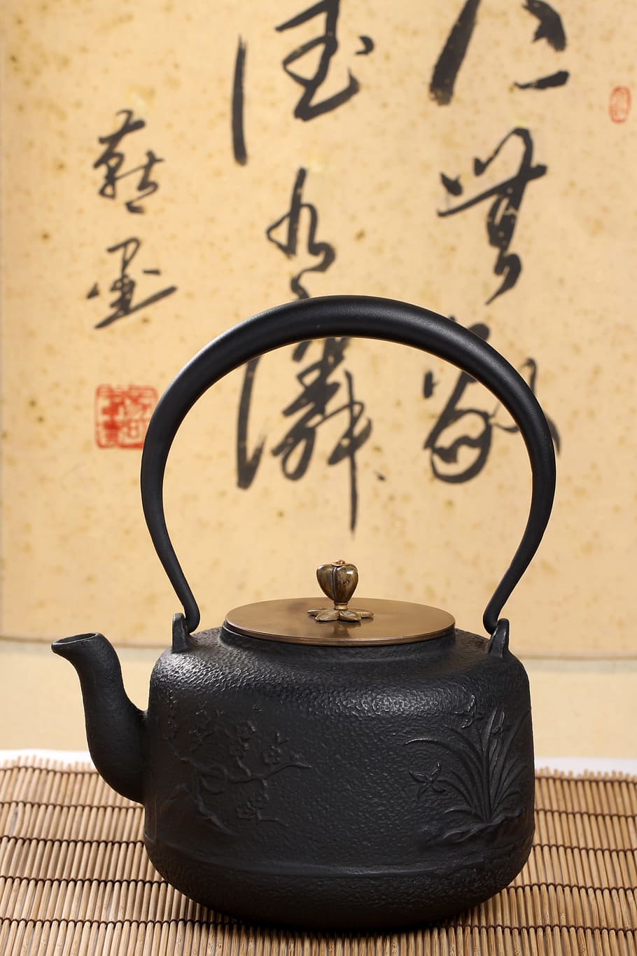 white kettle, tea, teapot, close-up, indoors, black color, still life, focus on foreground, wall - building feature, table