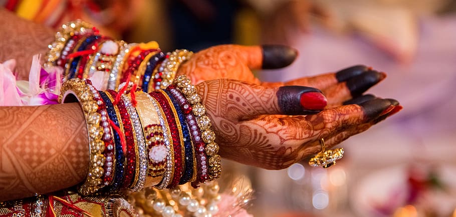 person wearing bracelets, wedding, marriage, hand painting, woman, happy, celebration, indian, traditions, mehndi