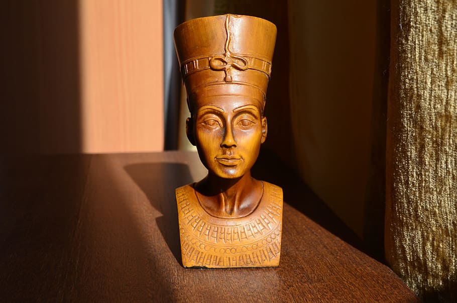 brown, wooden, egyptian headbust, table, closeup, nefertiti, the wife of the king akhenaten, egypt, indoors, gold colored
