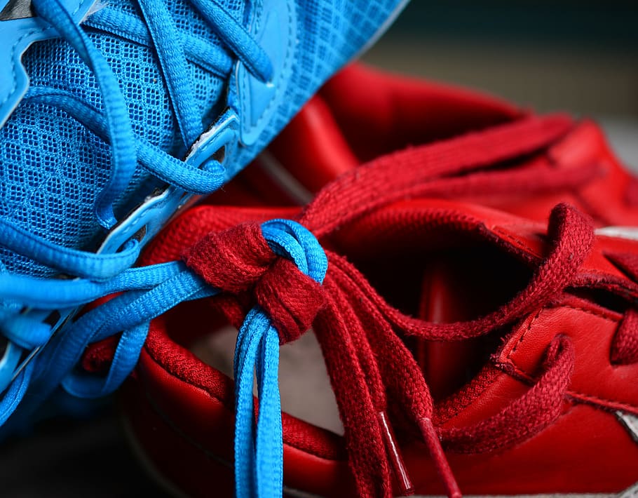 close-up photo, red, blue, lace, tied, together, shoelace, knot, knotted, keep together