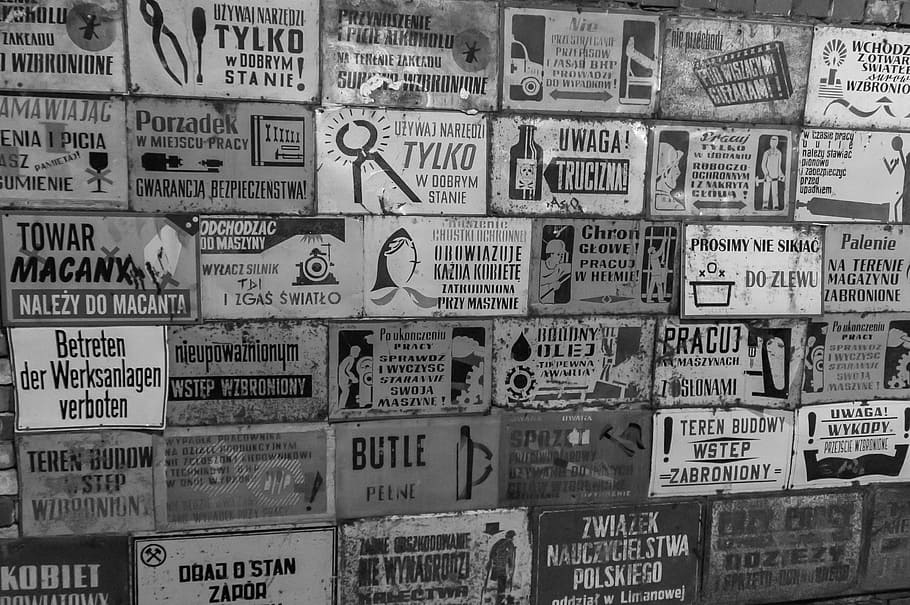 assorted, signage grayscale photography, poland, gold slope, wall, an array of, plates, descriptions, text, the content of the